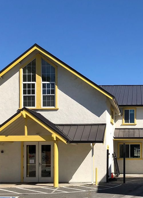 Exclusively Roofing Inc. logo